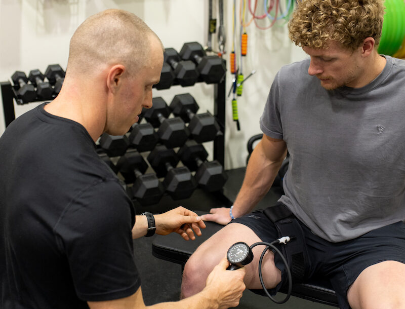 A man sitting on a bench with a stethoscope.